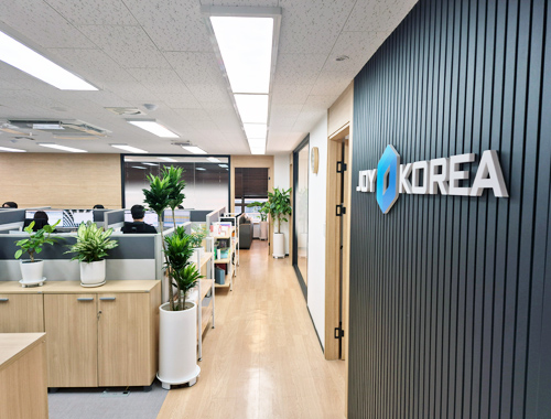 The modern entrance of the JOYKOREA office in Seoul.
